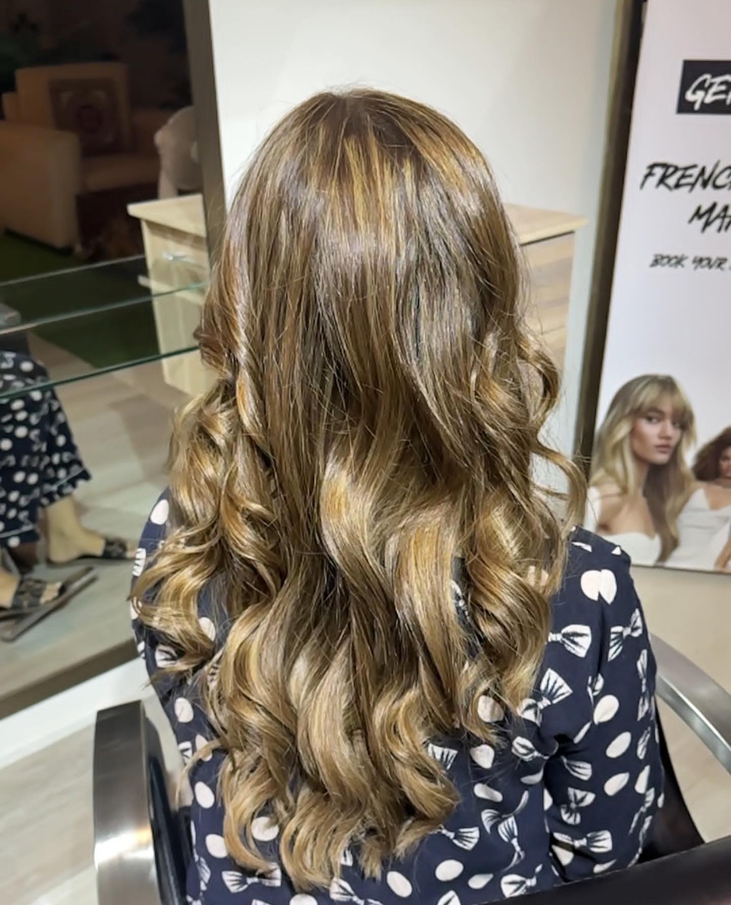 Long honey-blonde highlighted hair set in soft bouncy curls at TONES Hair & Beauty Salon, DHA Phase 6 Lahore